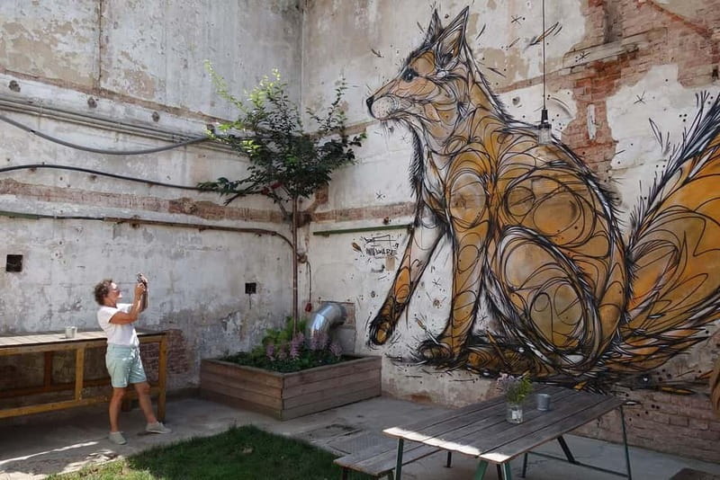 Prague: Alternative Prague Walking Tour - The underground venue made from old bus parts: techno and art