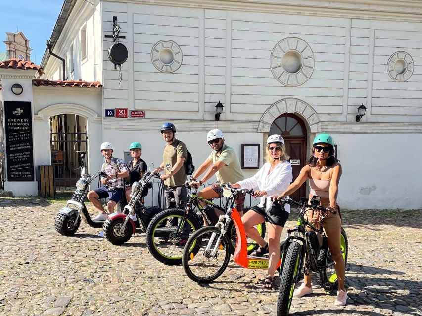 Prague: City Viewpoints Tour by Electric Fat Bike - Getting back through the center: bridges, palaces, and a metronome that surprises