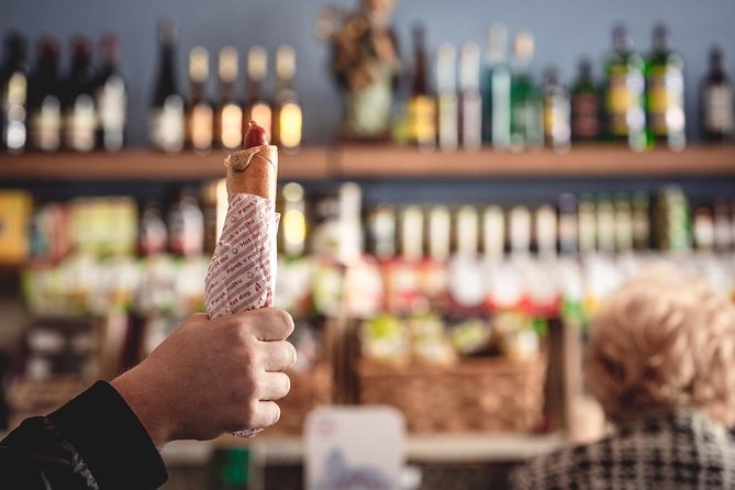 Prague Food Tour with 10 Tastings of Authentic Czech Classics - Entering Malá Strana on a food-first route