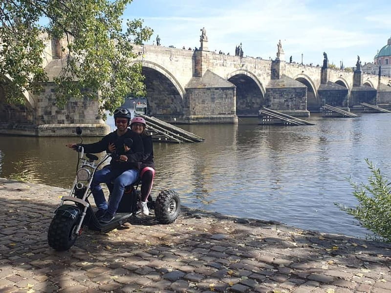 Prague: Guided Sightseeing Tour by Electric Trike - John Lennon Wall and Charles Bridge views: iconic streets with quick picture time