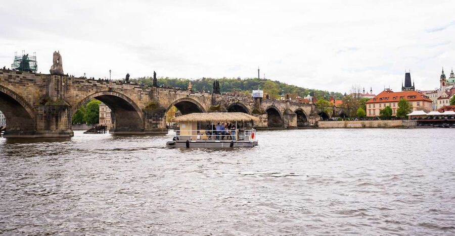 Prague: Party Tiki Boat Sightseeing Cruise with Drinks - Boarding Setup: Adjustable Seats, Tabletop Social Time, and a Starter Drink
