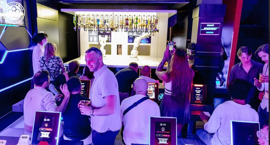 Prague: Robotic Bar Entry with a Drink Included - The main show: 100+ bottles and two robot arms